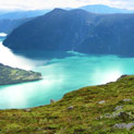 <desc>Captured this summer during another hiking tour. In the middle you can see some houses of urnes and if you know this place, you can imagine the stavechurch of urnes.</desc>